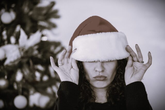 Portrait of woman in santa hat on Christmas